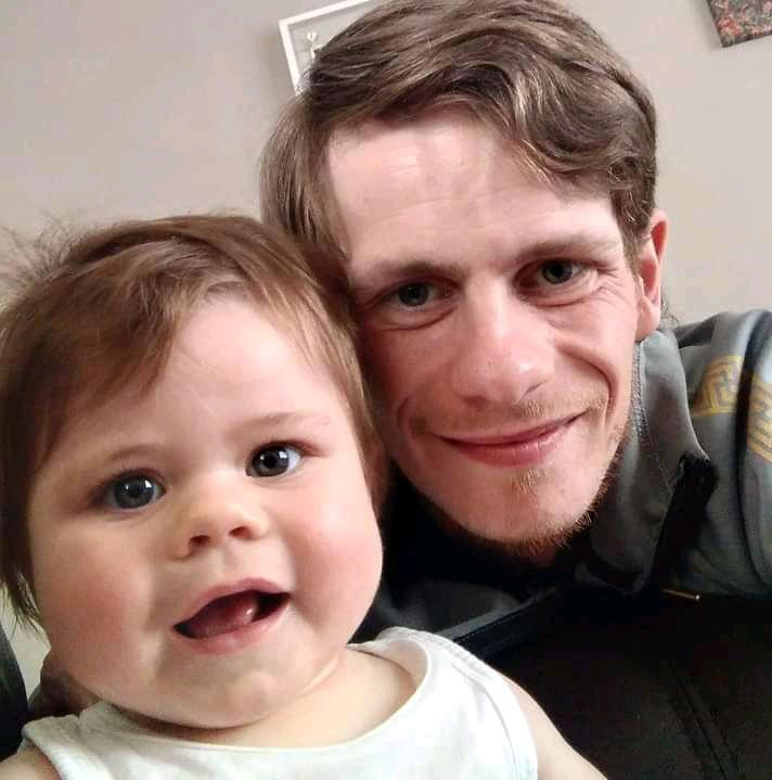 Dad and daughter smiling